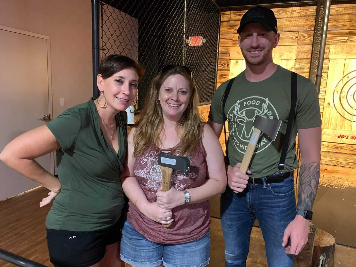 young people holding axes at JD's hideaway axe throwing venue